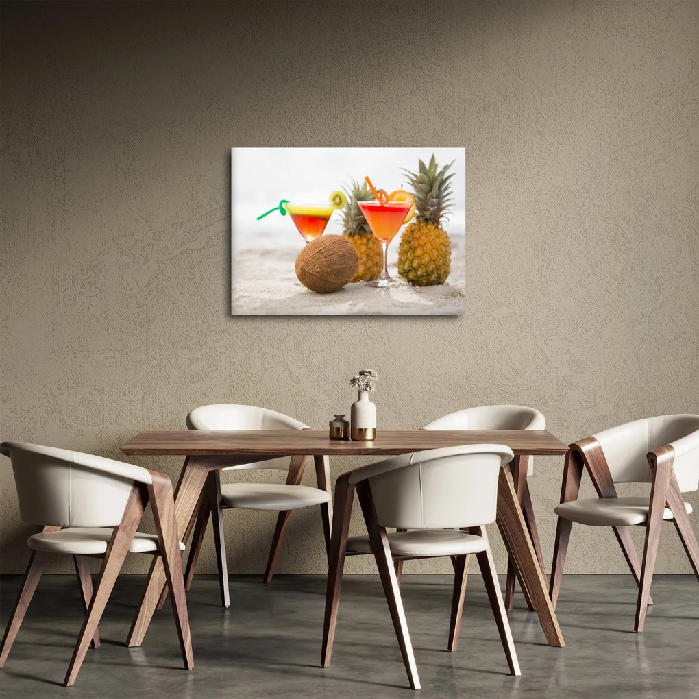 Obraz ananasów i szklanek na plaży (70x50 cm)