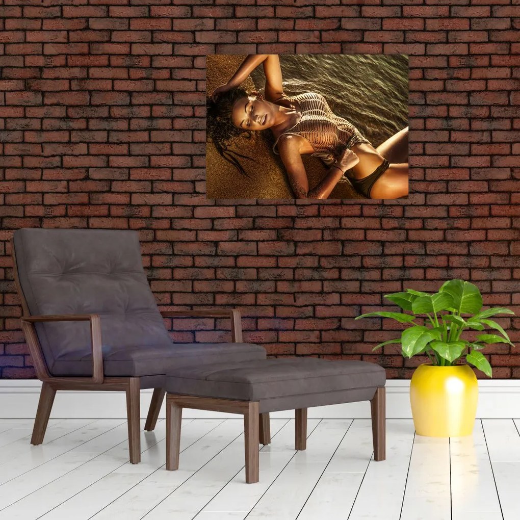 Obraz kobiety leżącej na plaży (70x50 cm)