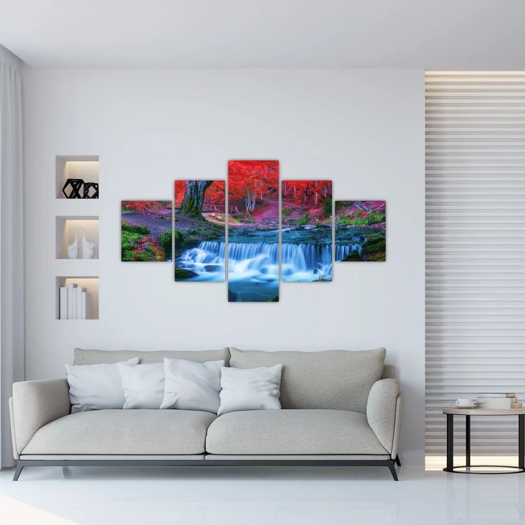 Obraz wodospadu w czerwonym lesie (125x70 cm)