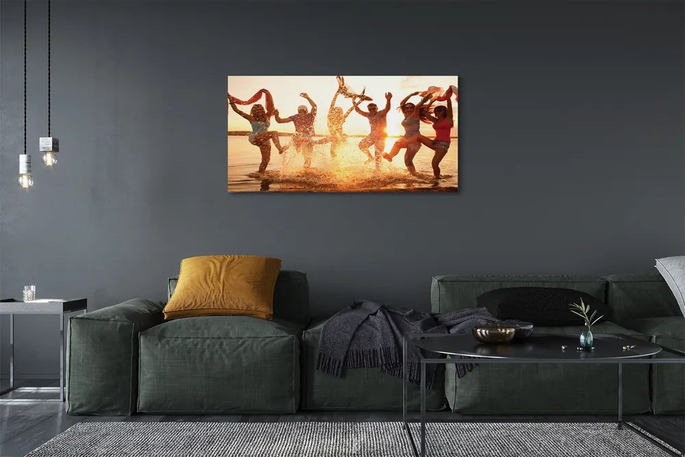 Obraz canvas na ścianę Ludzie nad Morzem o Zachodzie