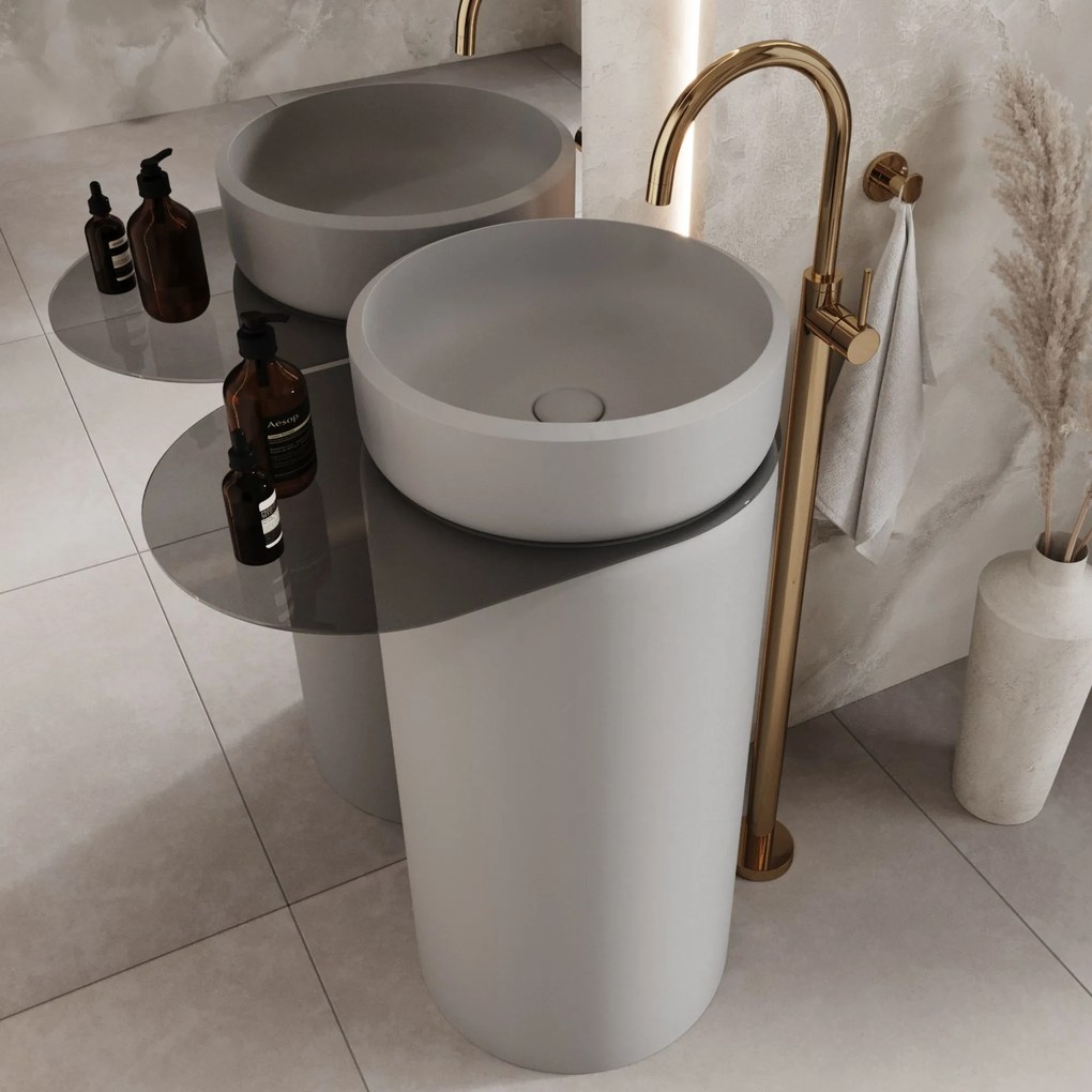 Umywalka z konglomeratu wolnostojąca okrągła z półką szklaną 85 x 40 cm RONA bez przelewu | Różne kolory półki : Kolor szkła - Czarny, Kolor umywalki RONA - Biały połysk, Podłączenie syfonu - Do ściany, Półka - Szklana