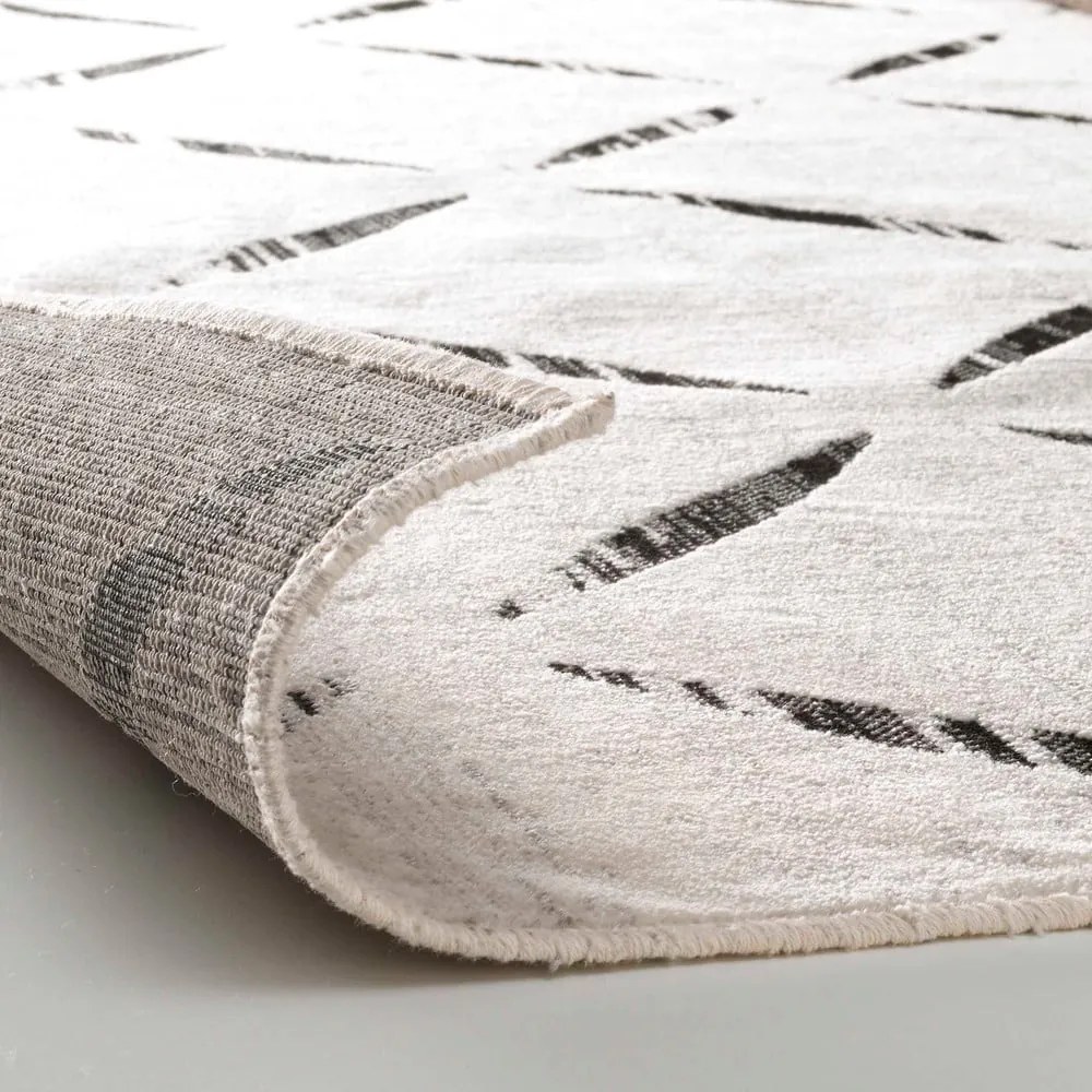 Beżowy dywan z mieszanki bawełny 68x110 cm Modesto – douceur d'intérieur