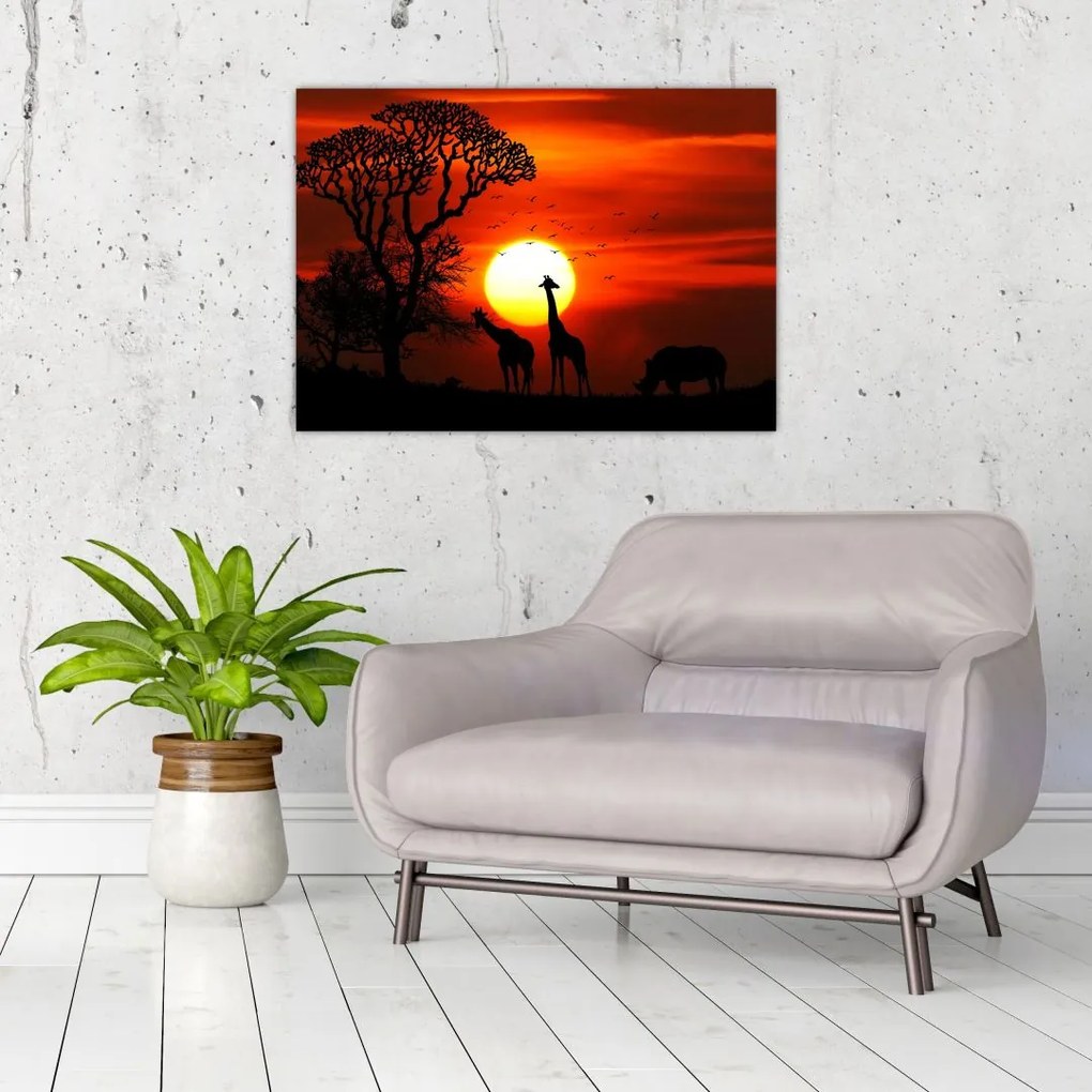 Obraz na szkle - Sylwetki zwierząt o zachodzie słońca (70x50 cm)