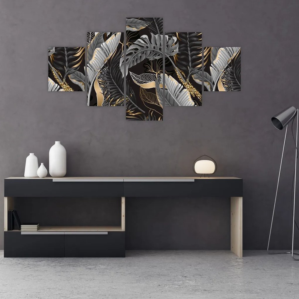 Obraz - Tropikalne liście w kolorze czarno - złotym (125x70 cm)