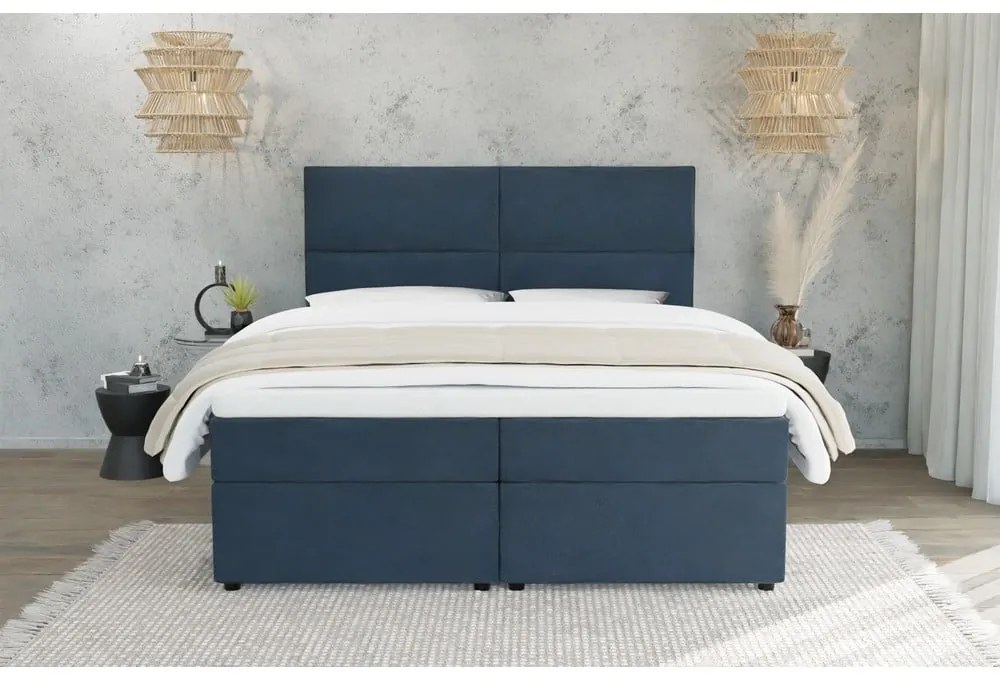 Ciemnoniebieskie łóżko boxspring ze schowkiem 140x200 cm Rico – Ropez