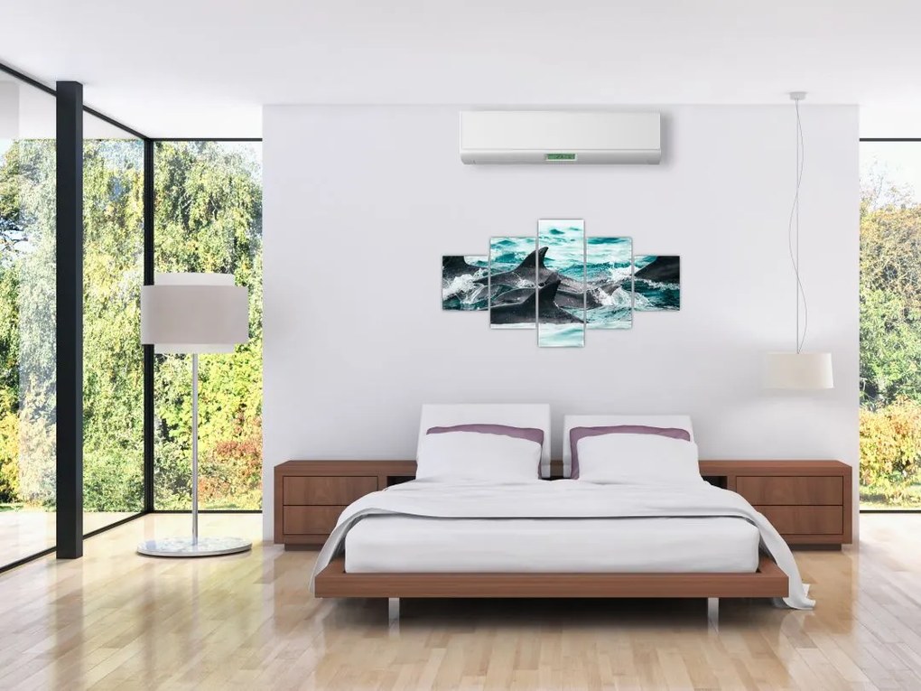 Obraz - Delfiny w oceanie (125x70 cm)
