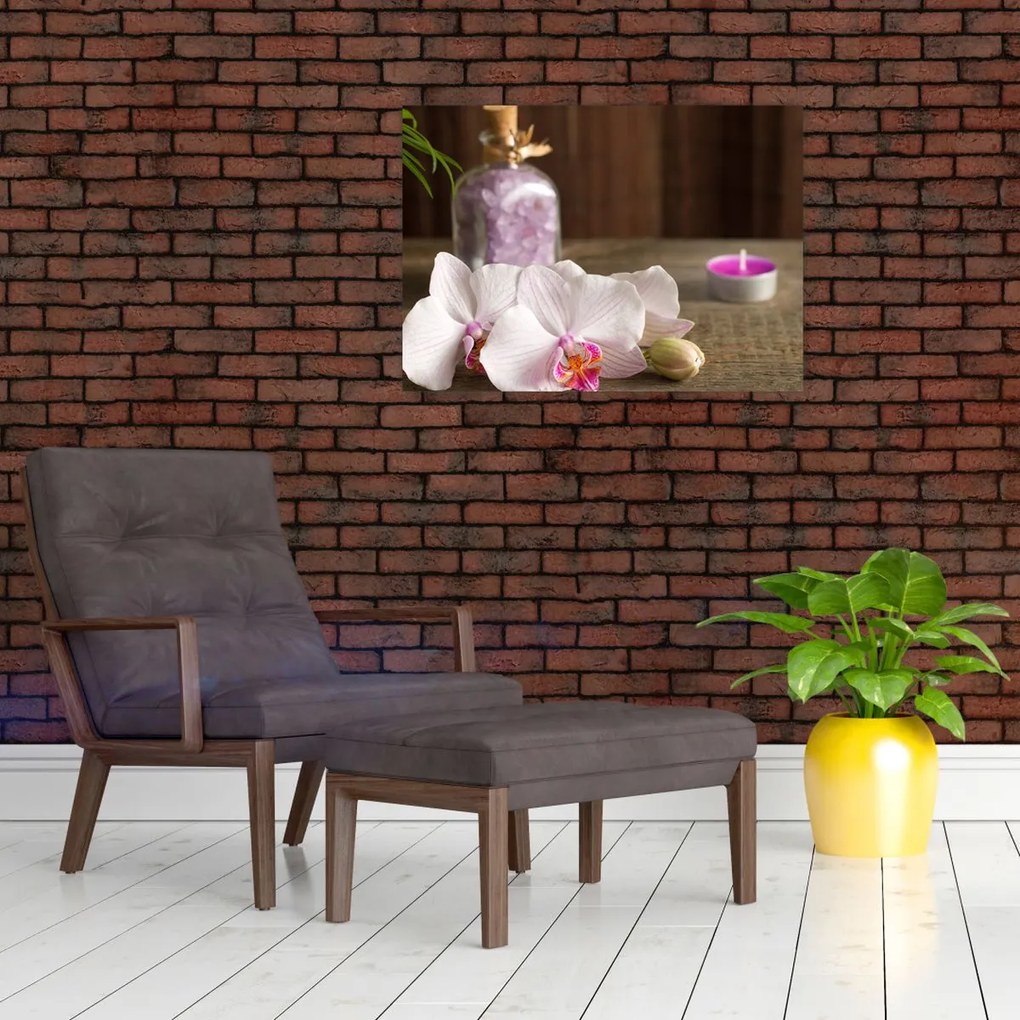 Obraz na szkle - Świeca i orchidee (70x50 cm)