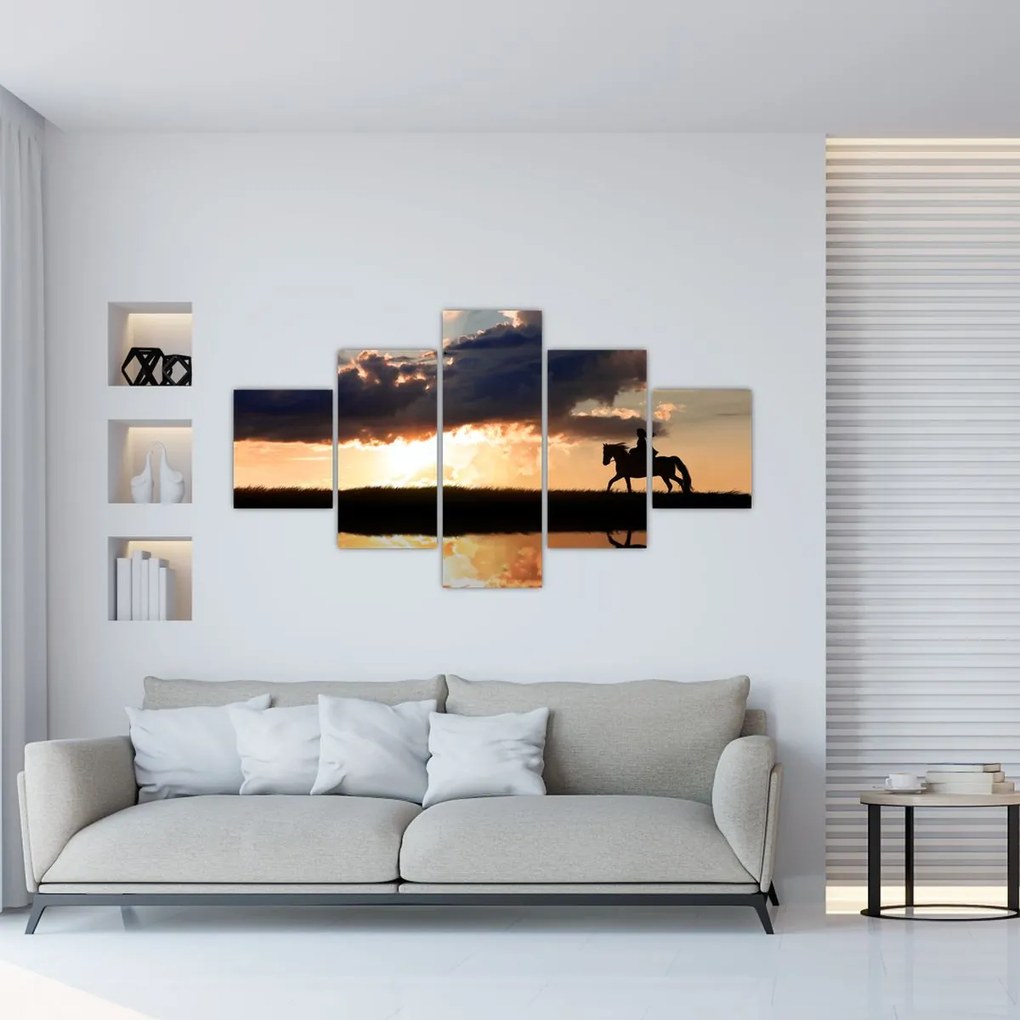 Obraz - Jeździec na koniu o zachodzie słońca (125x70 cm)