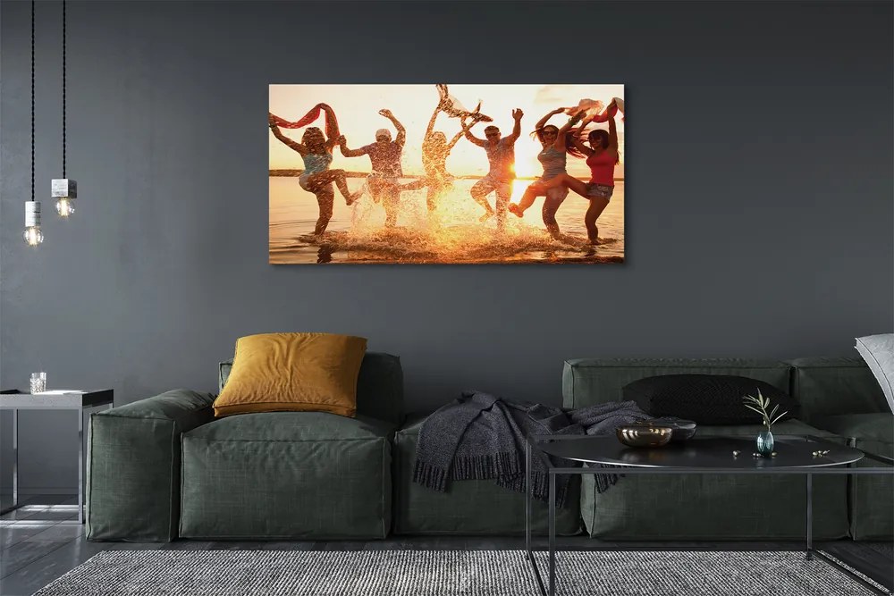 Obraz canvas na ścianę Ludzie nad Morzem o Zachodzie