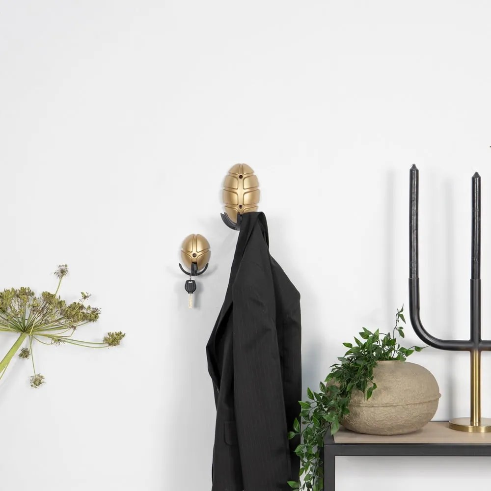 Czarny/w kolorze złota ścienny plastikowy haczyk Tick – Spinder Design