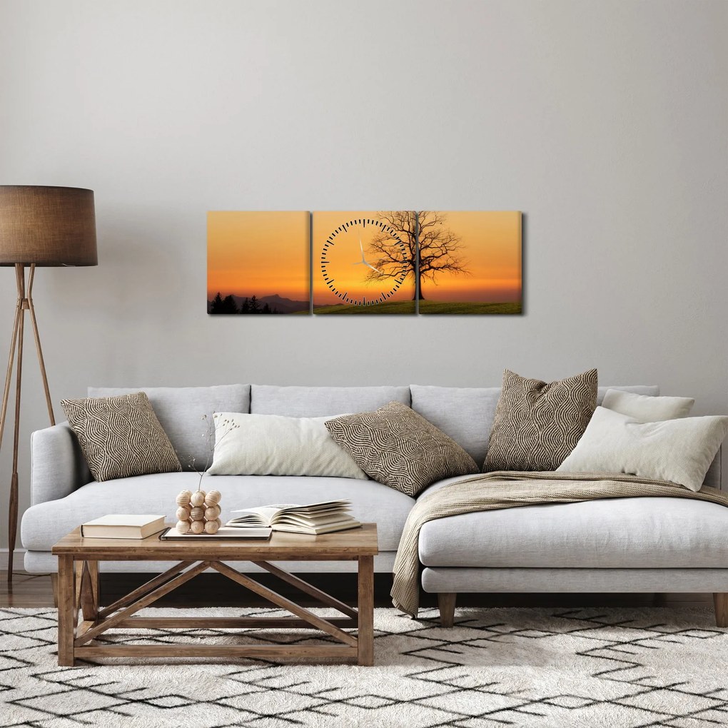 Obraz zachodu słońca na łące (z zegarem) (90x30 cm)