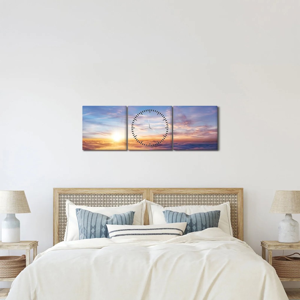 Obraz - Zachód słońca ponad chmurami (z zegarem) (90x30 cm)