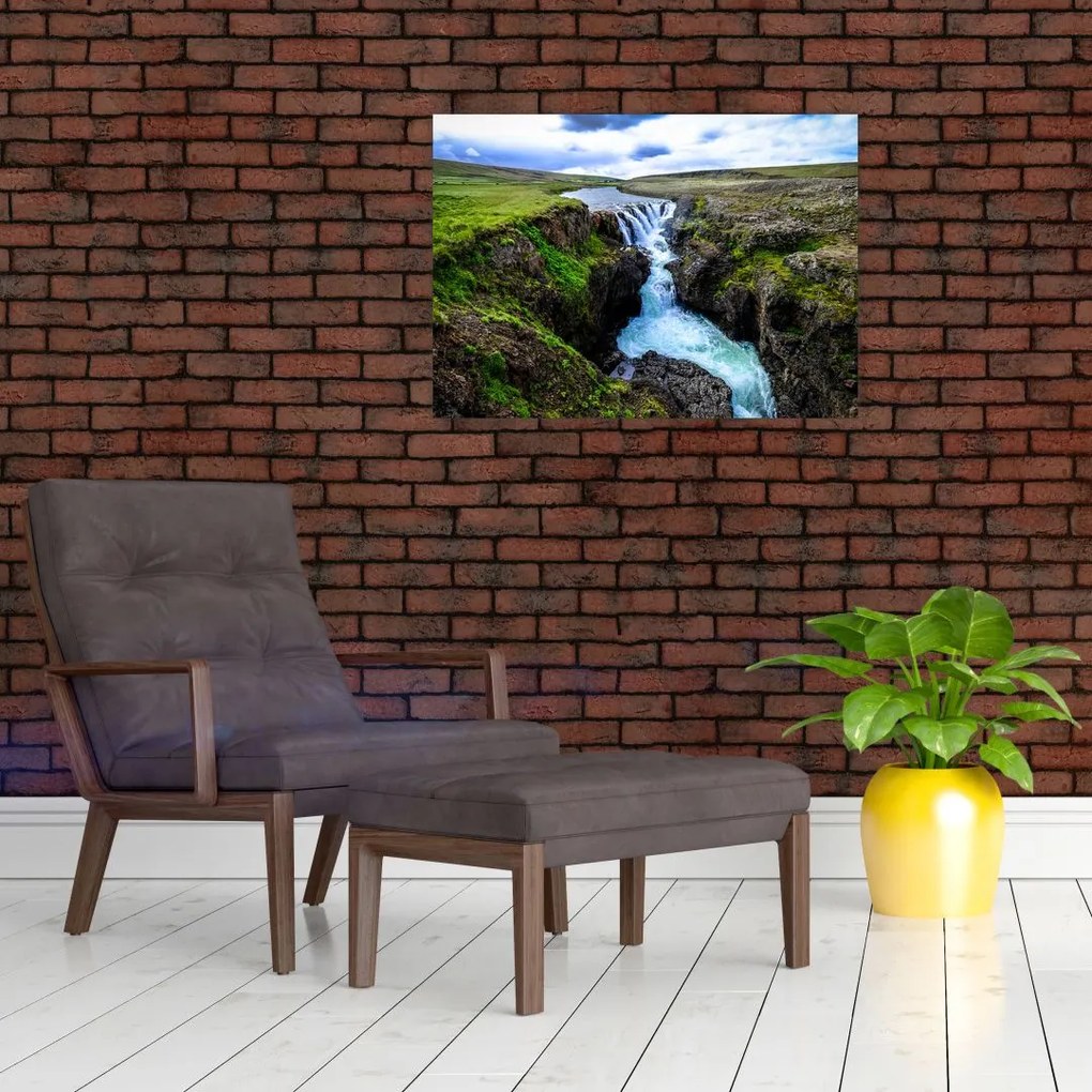 Obraz wodospadu między skałami (70x50 cm)
