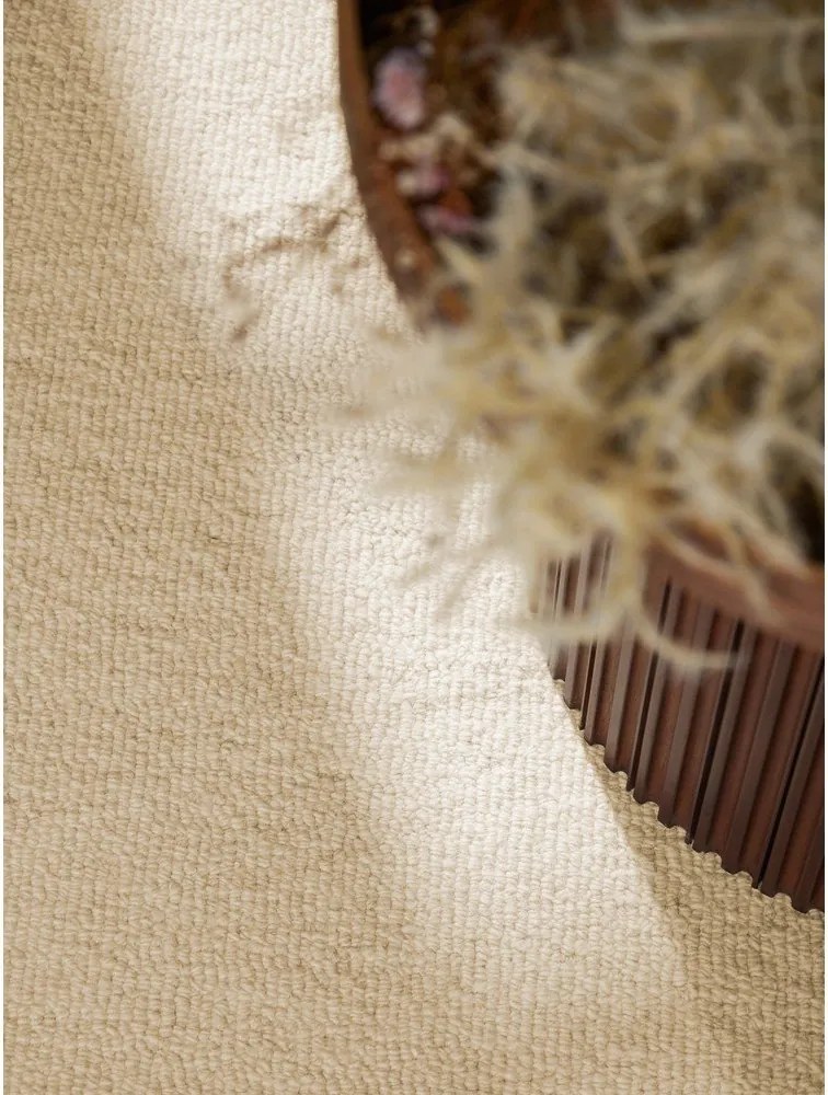 Beżowy wełniany okrągły dywan tkany ręcznie ø 160 cm Puristic Knots – Elle Decoration