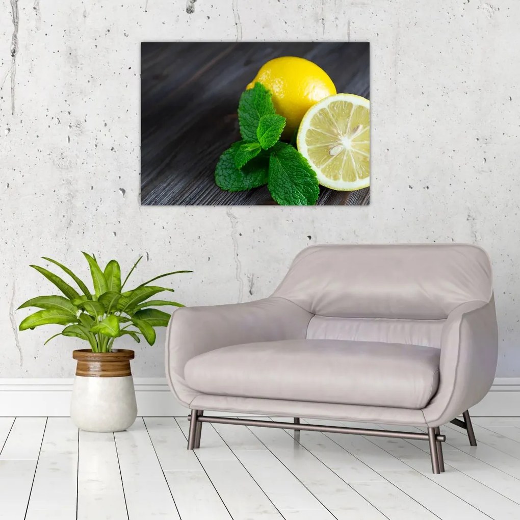 Obraz na szkle - cytryn i mięty na stole (70x50 cm)