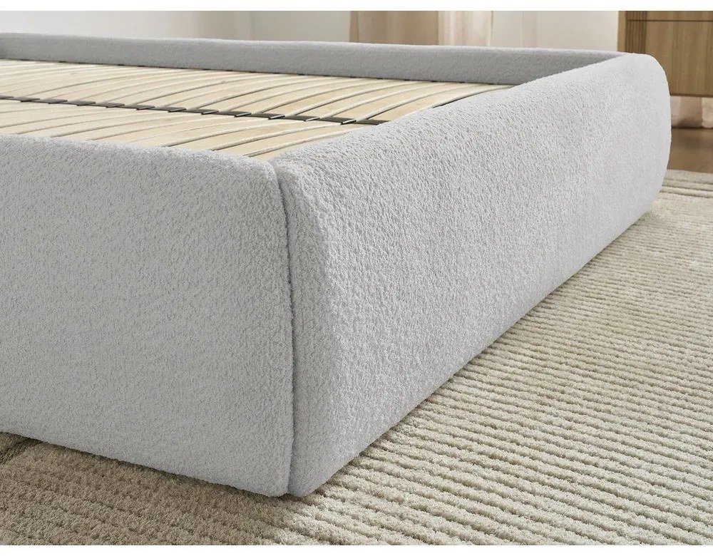 Jasnoszare tapicerowane łóżko dwuosobowe bez zagłówka ze schowkiem i stelażem 180x200 cm Inera – Bobochic Paris