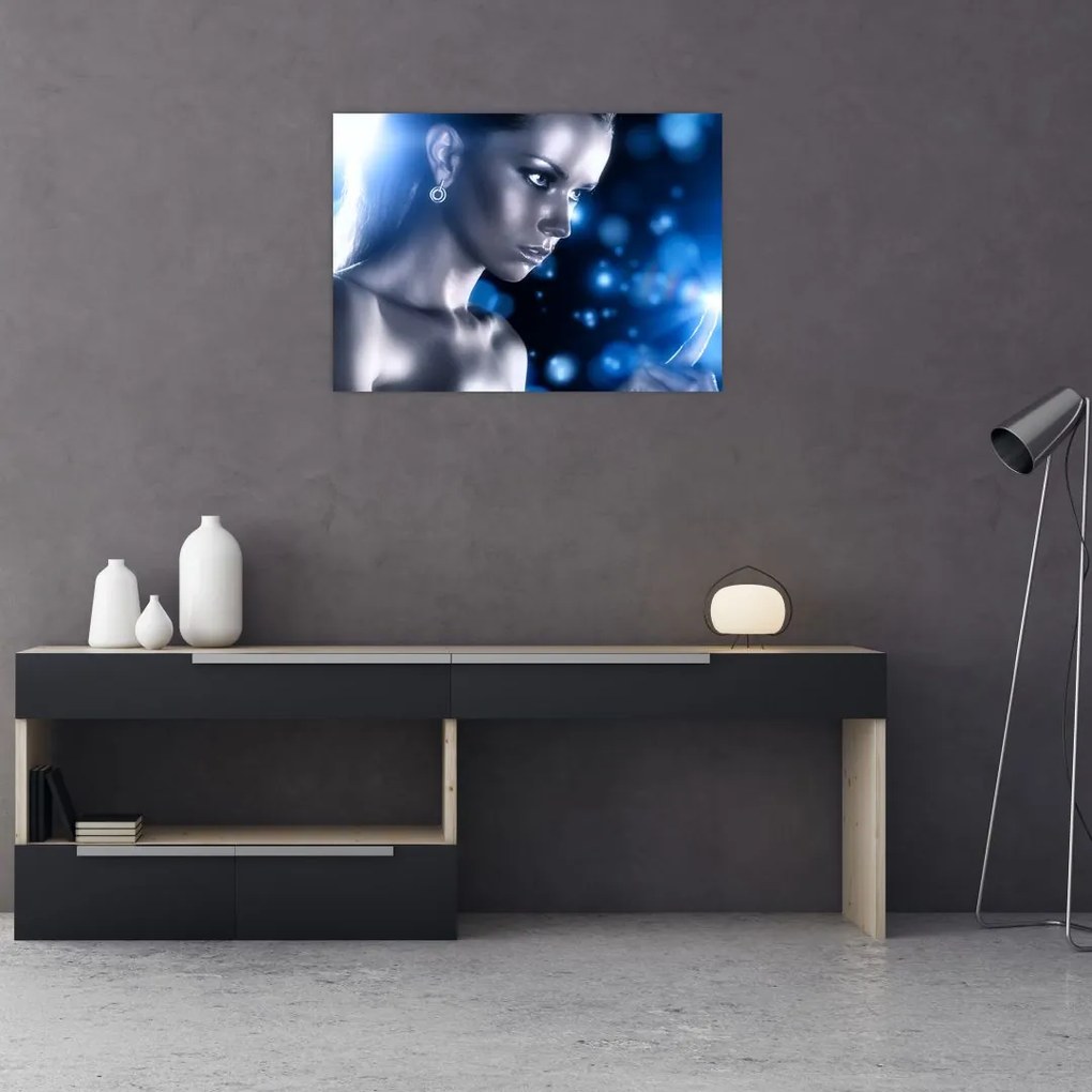 Obraz na szkle kobiety w niebieskim blasku (70x50 cm)
