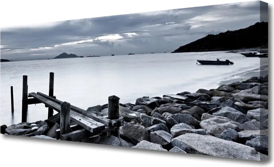 Obraz na płótnie Kamienista Plaża o Zmierzchu