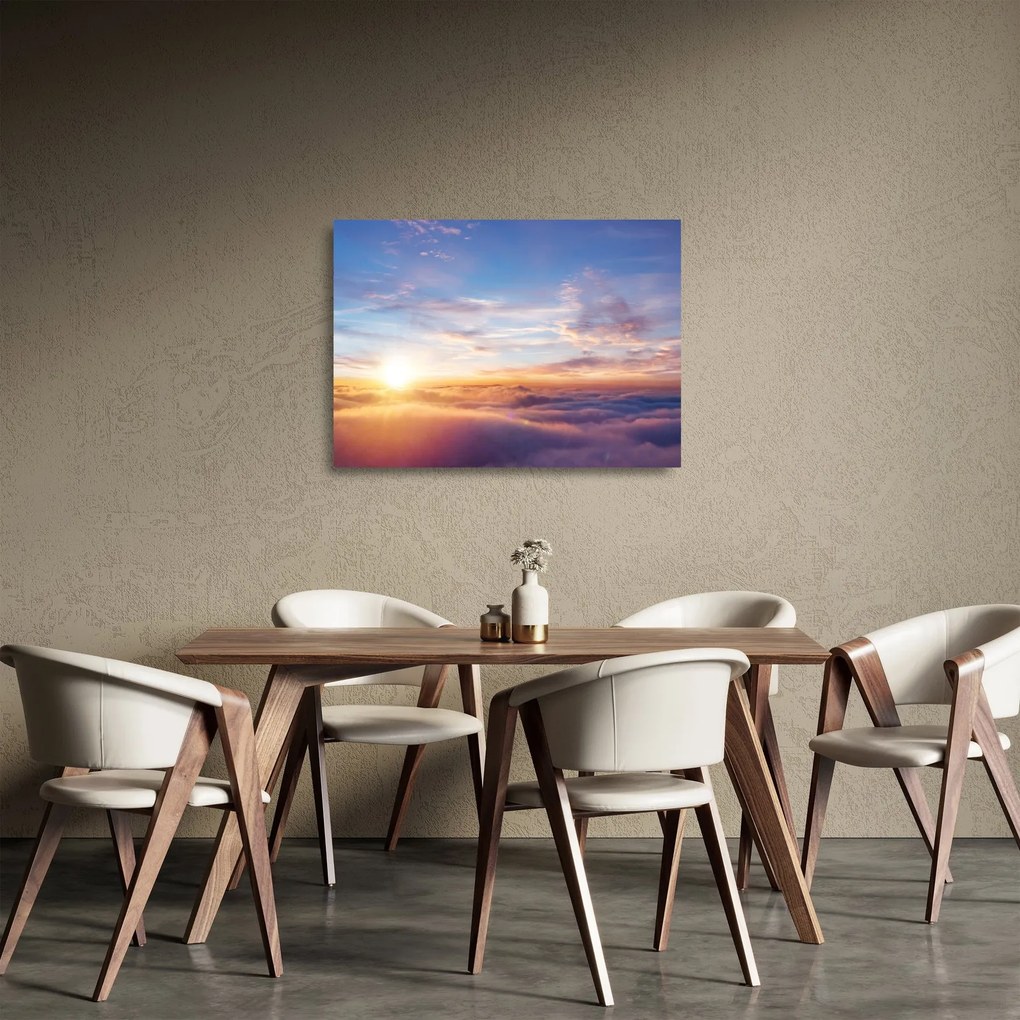 Obraz na szkle - Zachód słońca ponad chmurami (70x50 cm)