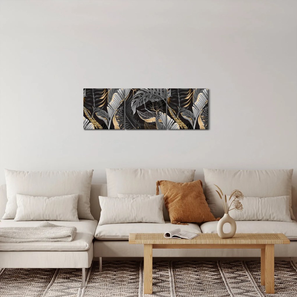 Obraz - Tropikalne liście w kolorze czarno - złotym (z zegarem) (90x30 cm)