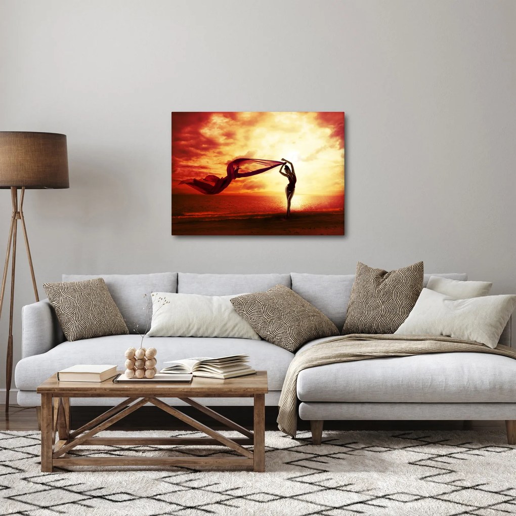 Obraz - Sylwetka kobiety o zachodzie słońca (70x50 cm)