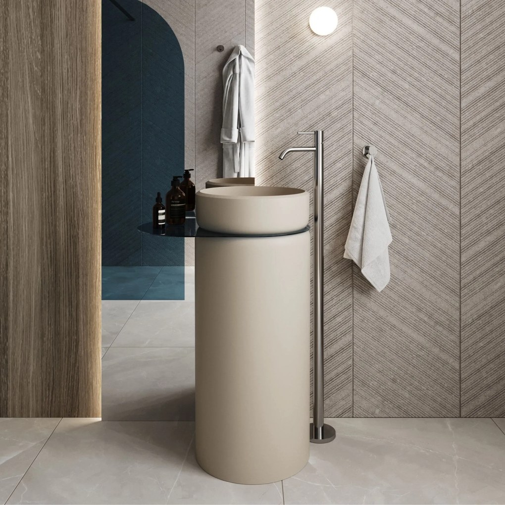 Umywalka z konglomeratu wolnostojąca okrągła z półką szklaną 85 x 40 cm RONA bez przelewu | Różne kolory półki : Kolor szkła - Niebieski, Kolor umywalki RONA - Beż połysk, Podłączenie syfonu - Do ściany, Półka - Szklana