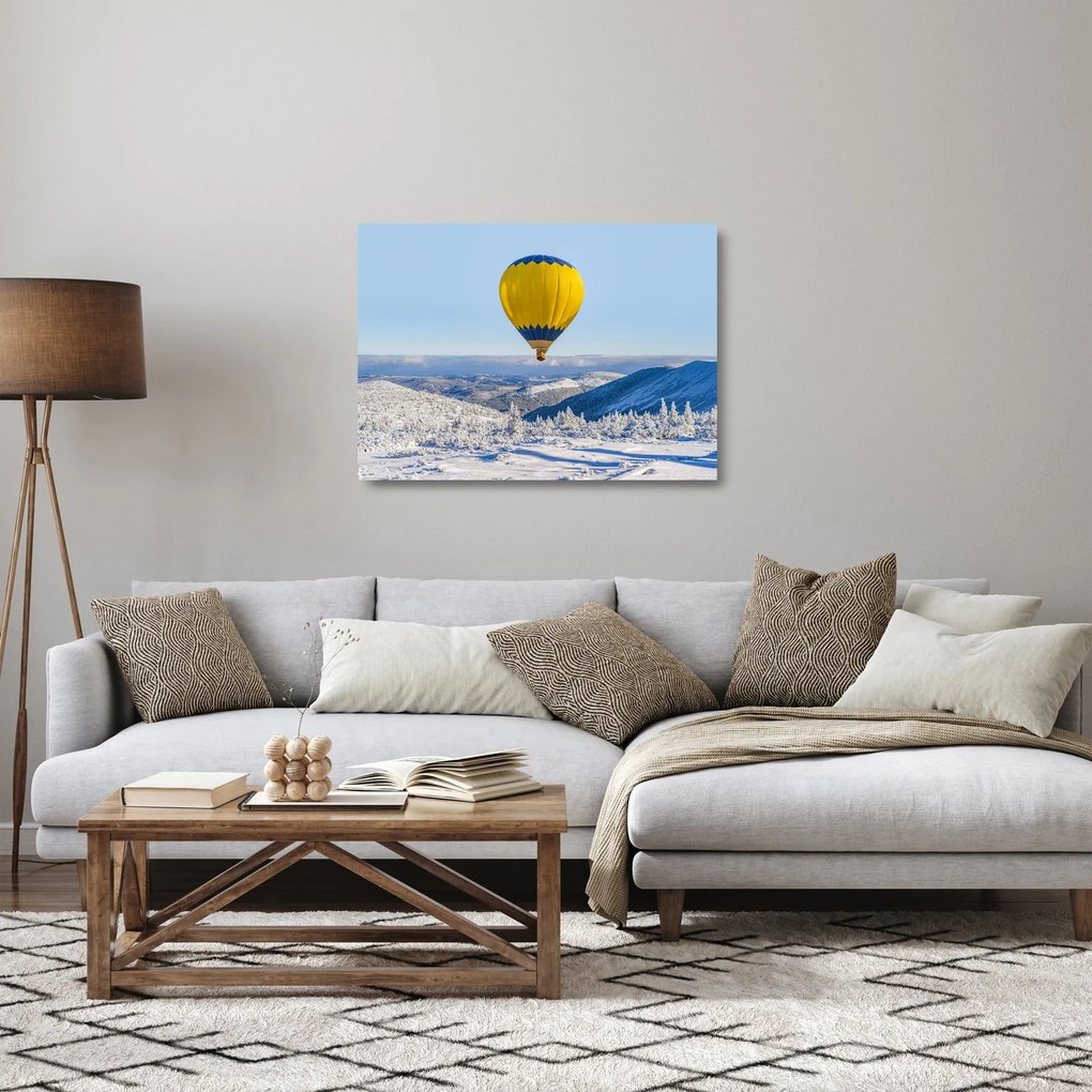 Obraz na szkle - Lot nad zimowym krajobrazem (70x50 cm)