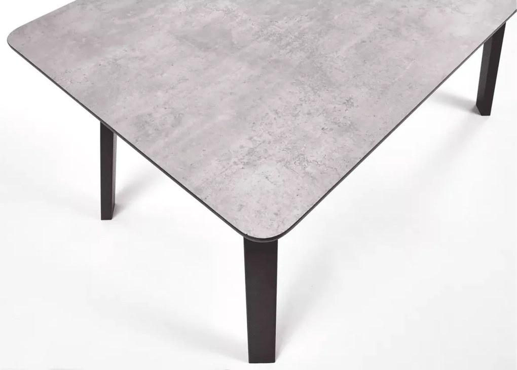 Stół Urbanico 160x90 cm z blatem MDF w kolorze szarego betonu na czarnych nogach do loftowej jadalni