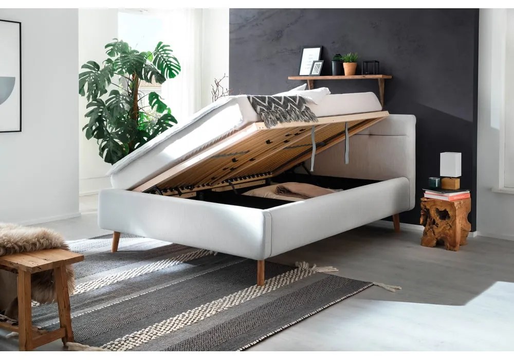 Jasnoszare tapicerowane łóżko dwuosobowe ze schowkiem i stelażem 140x200 cm Lotte – Meise Möbel