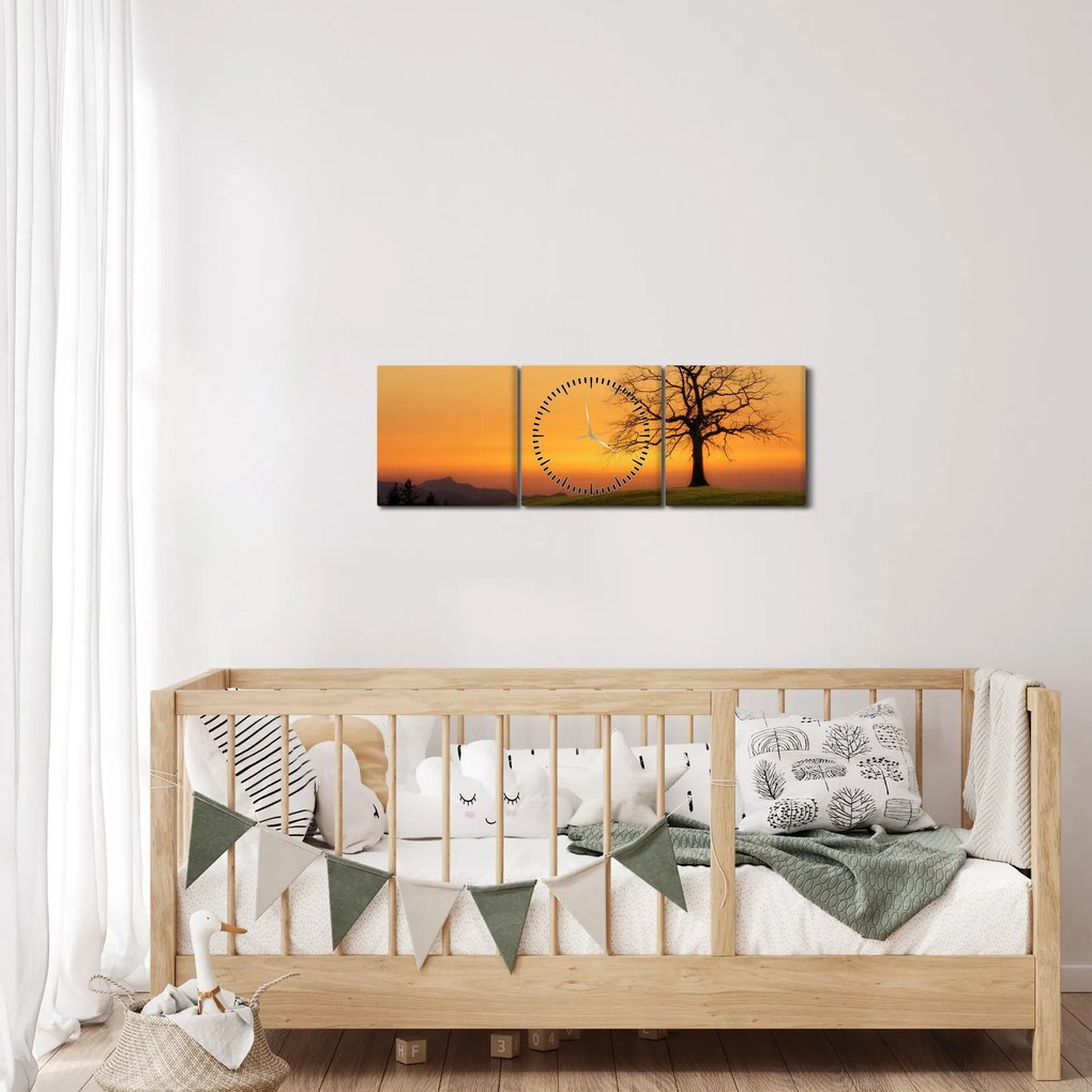 Obraz zachodu słońca na łące (z zegarem) (90x30 cm)