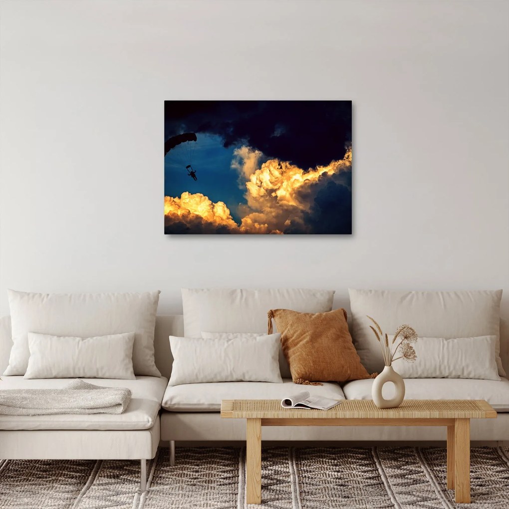 Obraz skoczka spadochronowego w chmurach (70x50 cm)