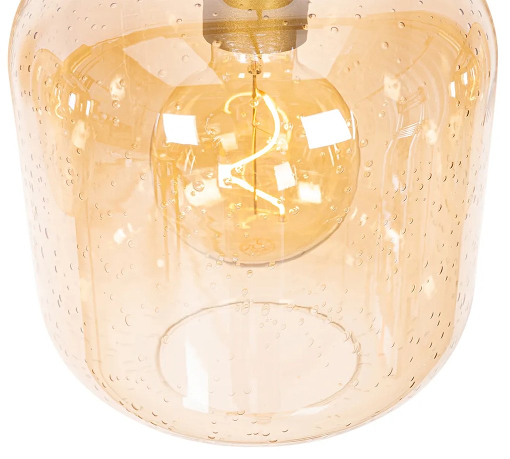 Designerska lampa wisząca czarna z mosiądzem i bursztynowym szkłem 4-światłowa - ZuzannaDesignerski Oswietlenie wewnetrzne