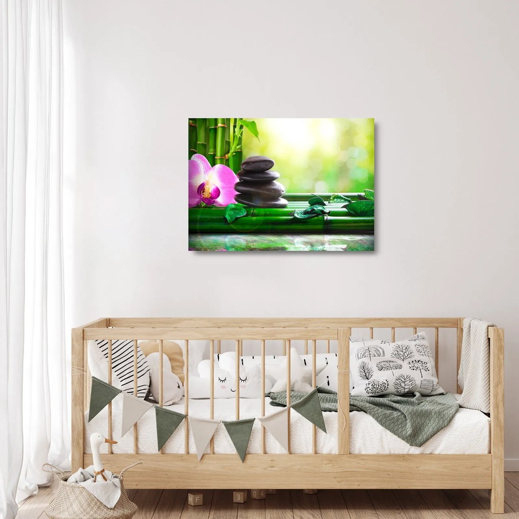 Obraz na szkle - kamienie do masażu i storczyki na wodzie (70x50 cm)