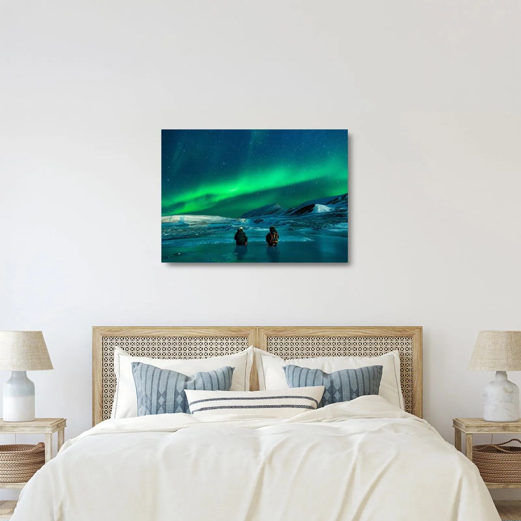 Obraz na szkle ludzi w pobliżu zorzy polarnej (70x50 cm)