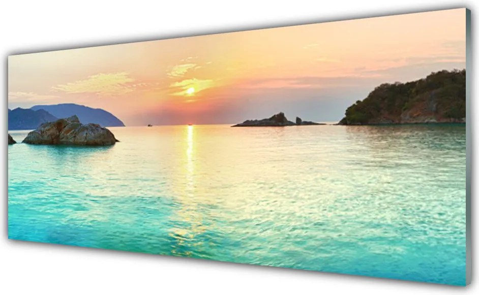 Panel Szklany Słoneczny Blask na Skalistym Brzegu