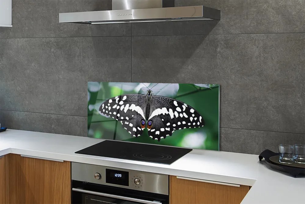 Panel Szklany Motyl na Zielonych Liściach