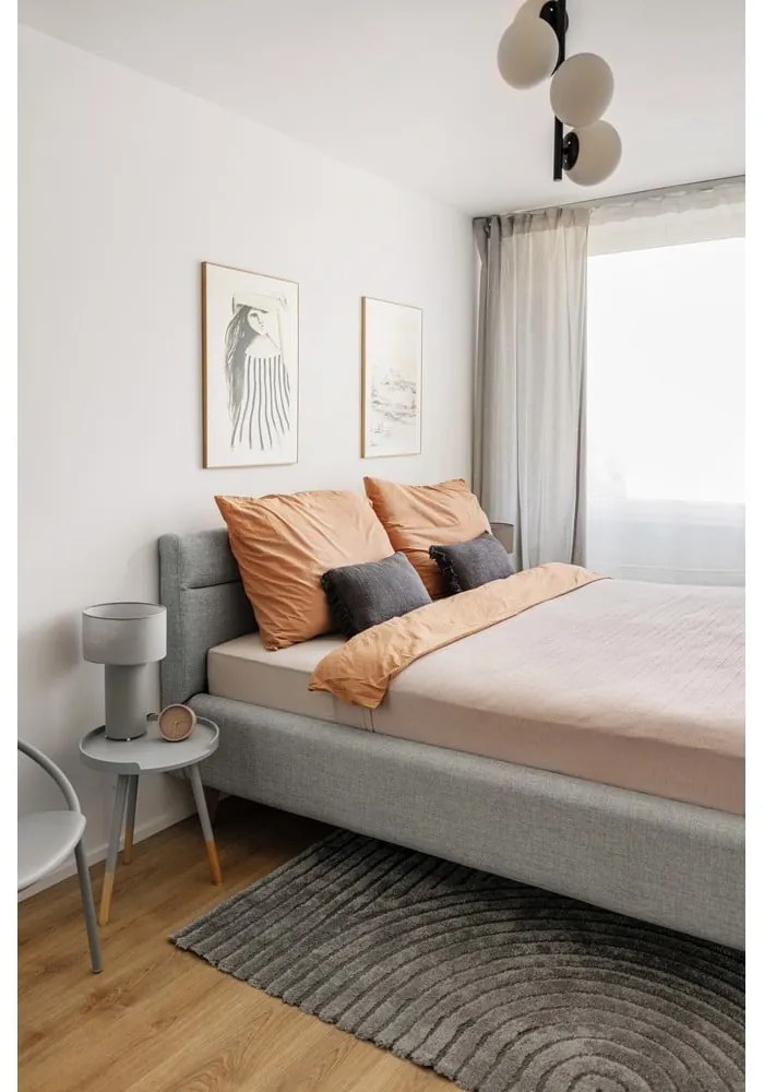 Jasnoszare tapicerowane łóżko dwuosobowe ze schowkiem i stelażem 180x200 cm Lotte – Meise Möbel