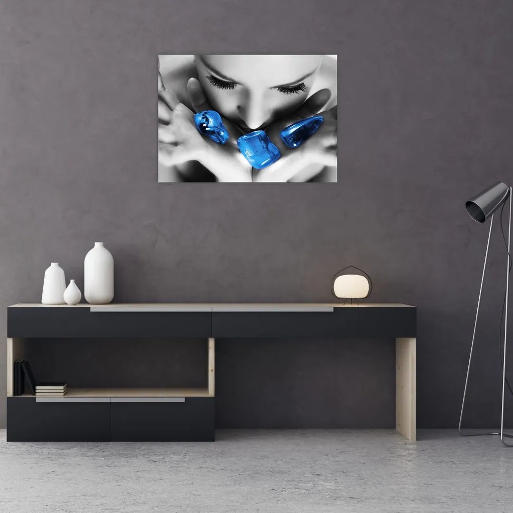 Obraz na szkle portretu kobiety z kamieniami (70x50 cm)