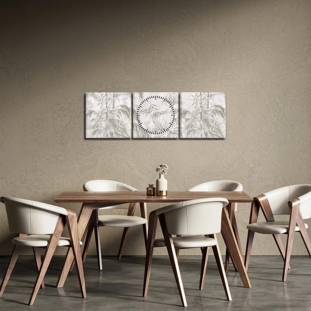 Obraz - Tropikalne rośliny na ścianie w kolorze szarym (z zegarem) (90x30 cm)