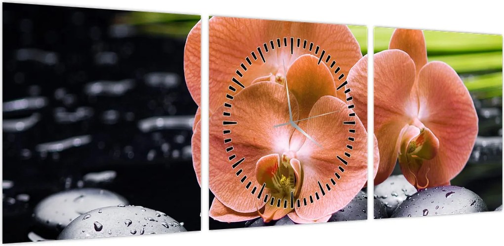 Obraz - Pomarańczowa orchidea z liśćmi palmy (z zegarem) (90x30 cm)