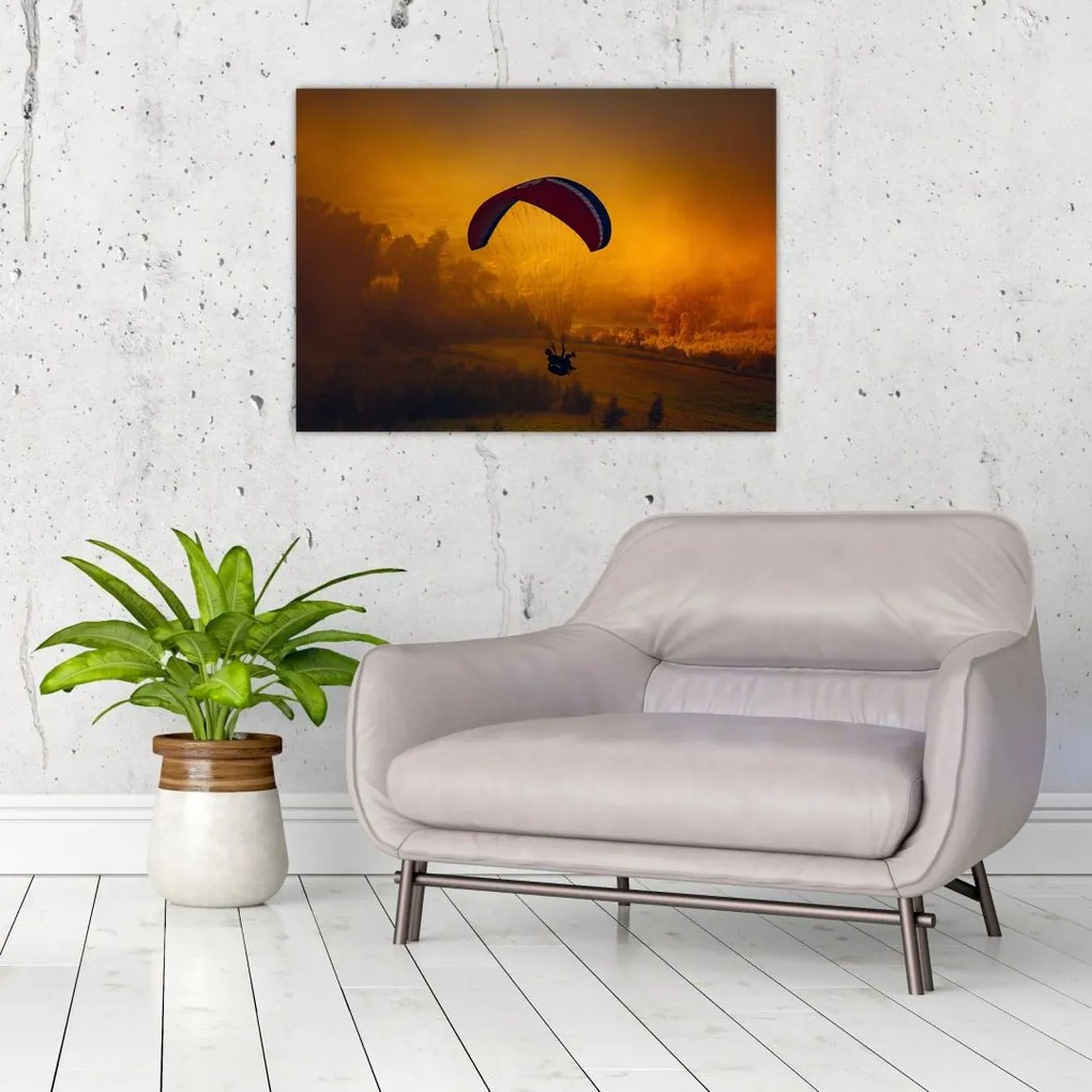 Obraz na szkle - spadochroniarz o zachodzie słońca (70x50 cm)