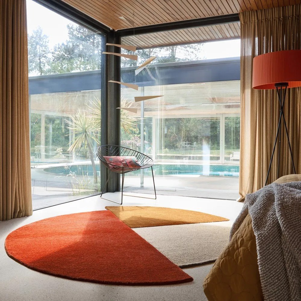 Ceglasty wełniany okrągły dywan tkany ręcznie ø 150 cm Mia Segment – Flair Rugs
