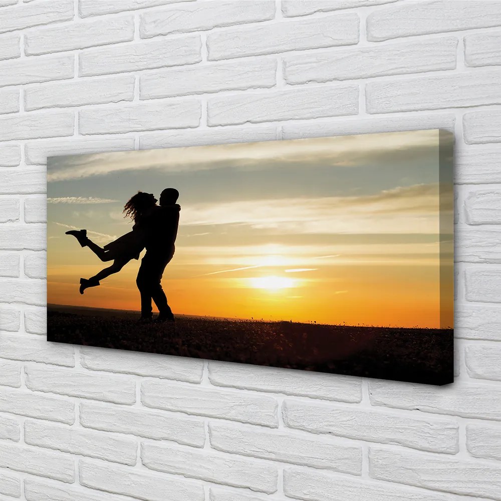 Duży obraz na płótnie Ludzie i Chmury o Zachodzie