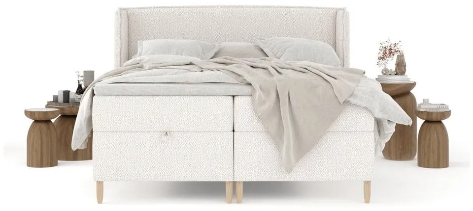 Kremowe łóżko boxspring ze schowkiem 180x200 cm Monpelli – Maison de Rêve