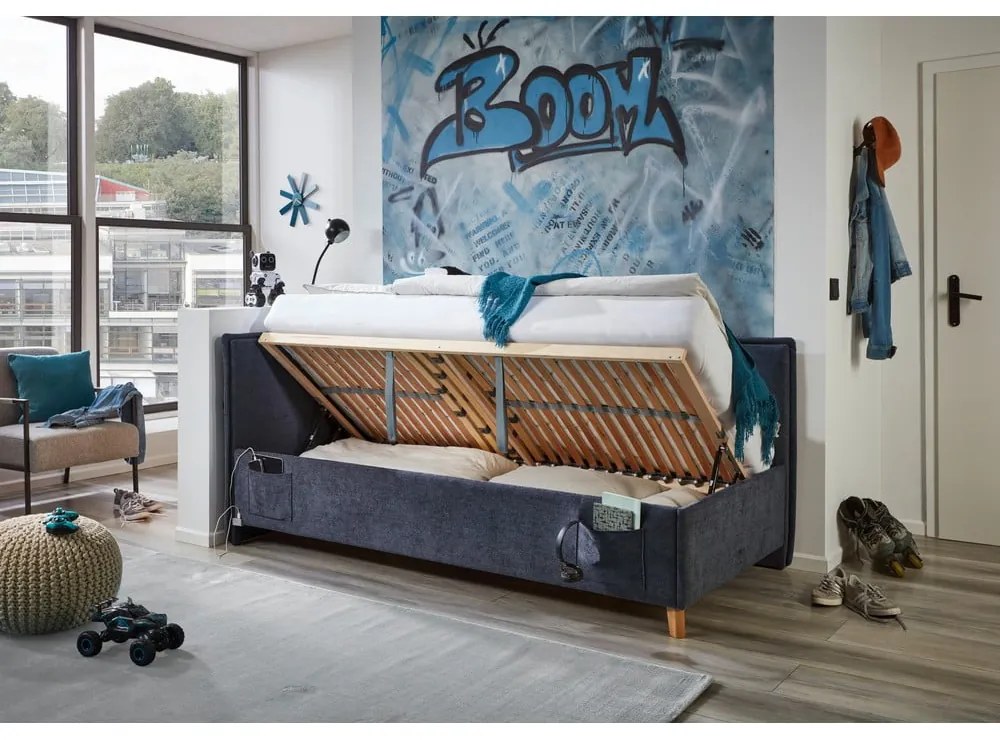 Ciemnoniebieskie tapicerowane narożne łóżko dziecięce ze schowkiem ze stelażem 120x200 cm Fun – Meise Möbel