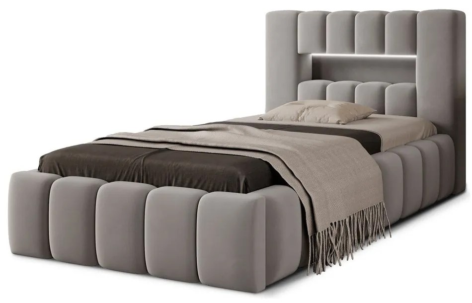 Szare tapicerowane łóżko jednoosobowe ze schowkiem ze stelażem 90x200 cm Lamica – ELTAP