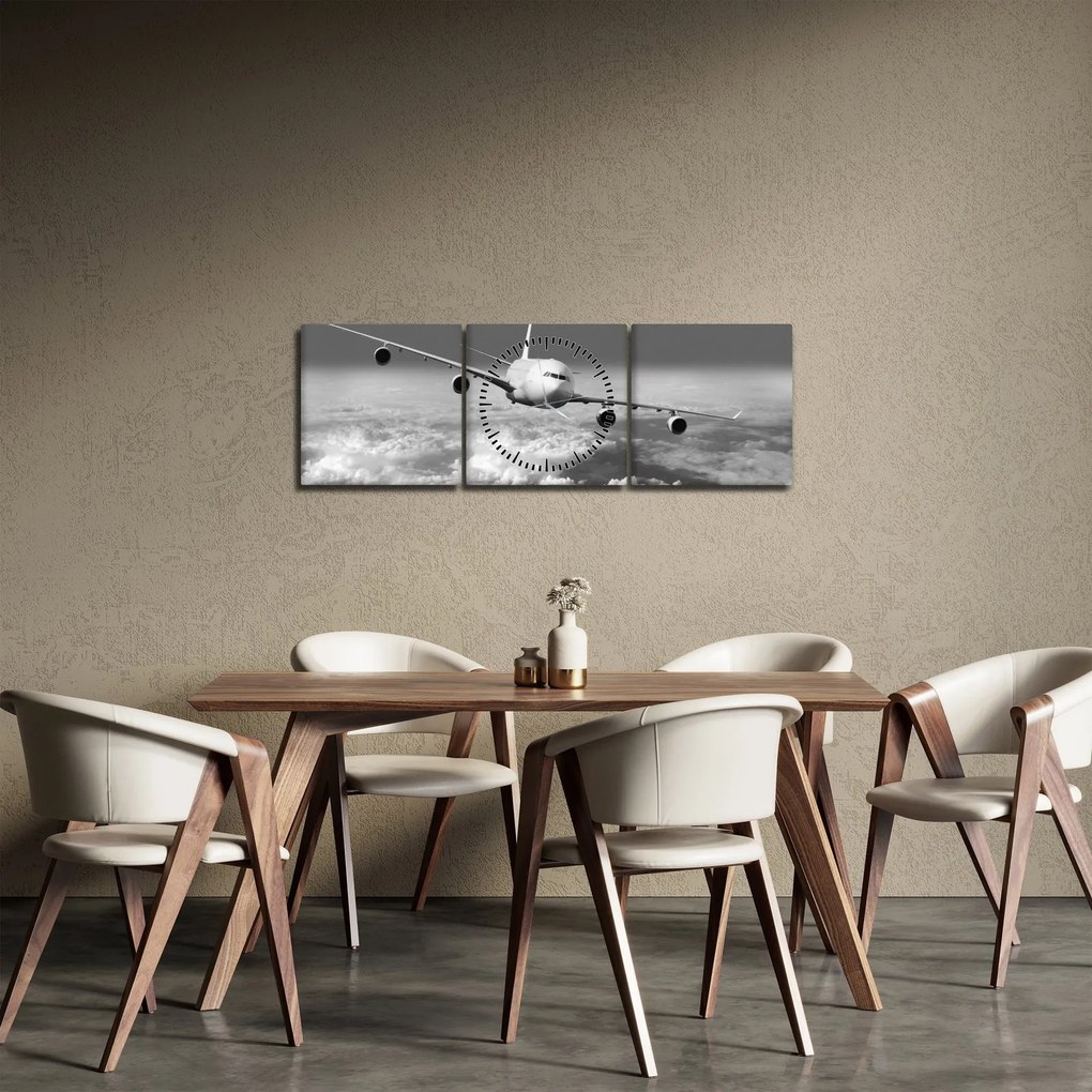Obraz - Samolot w chmurach, czarno-biały (z zegarem) (90x30 cm)
