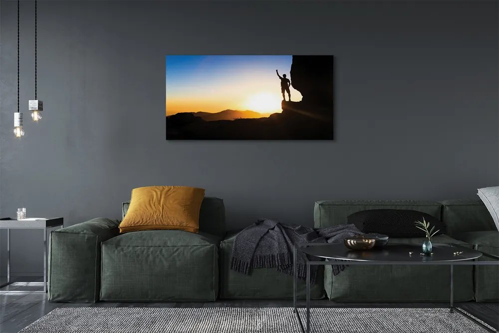 Obraz drukowany na płótnie Człowiek w Górach o Zachodzie