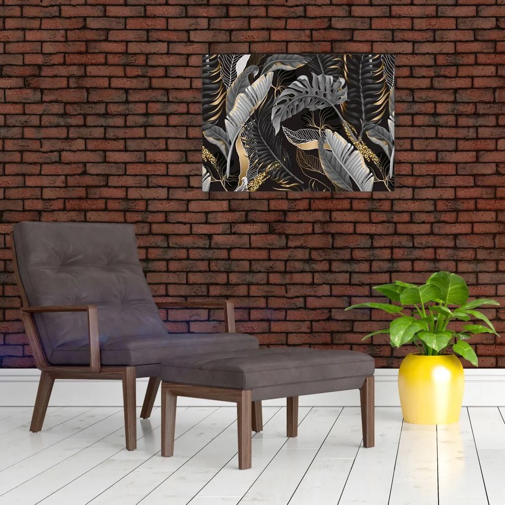 Obraz - Tropikalne liście w kolorze czarno - złotym (70x50 cm)