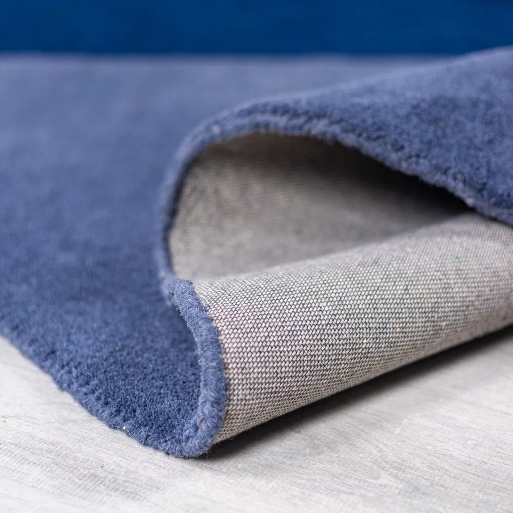 Niebieski wełniany okrągły dywan tkany ręcznie ø 150 cm Mia Segment – Flair Rugs